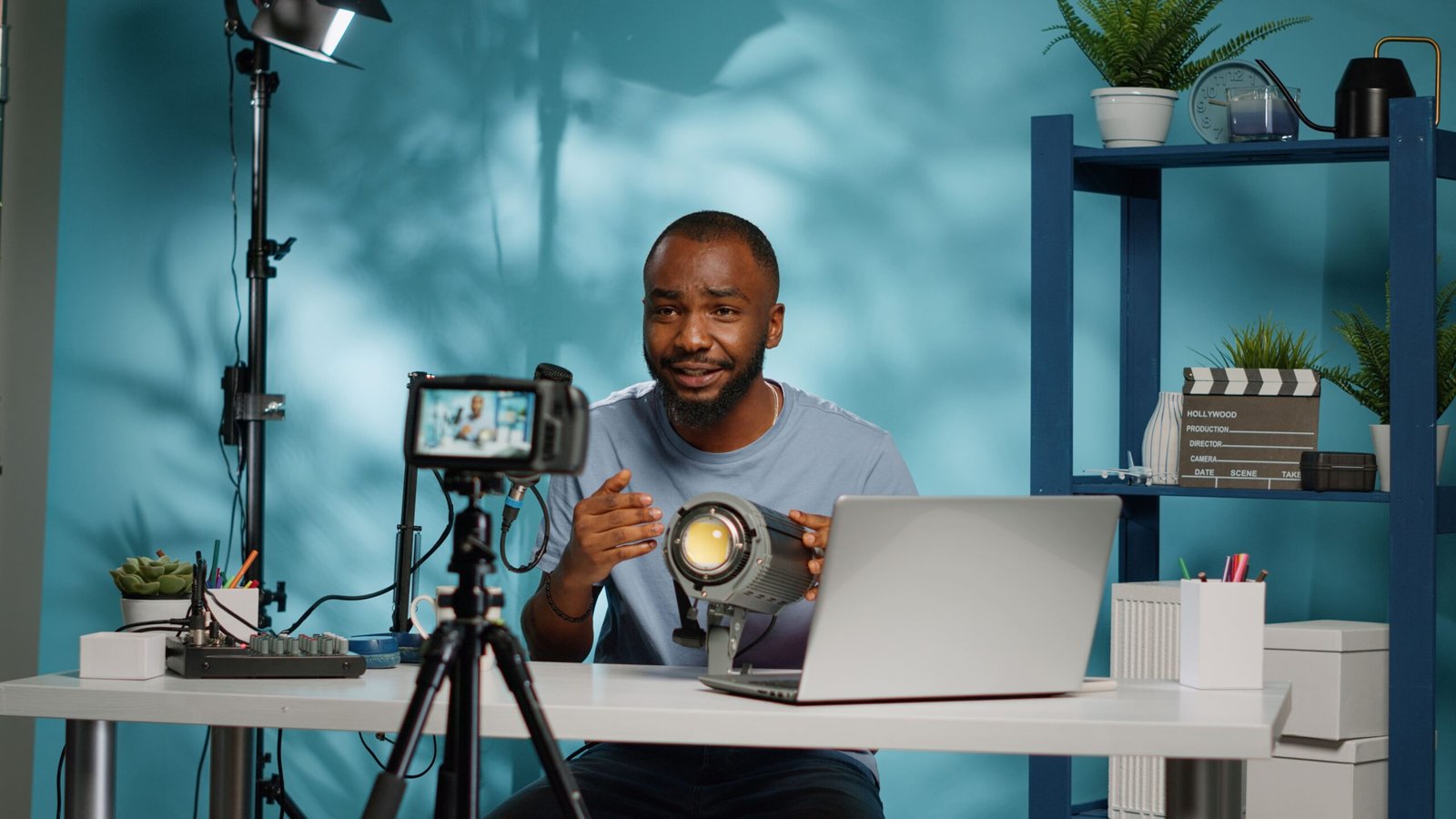 african-american-blogger-reviewing-studio-light-camera